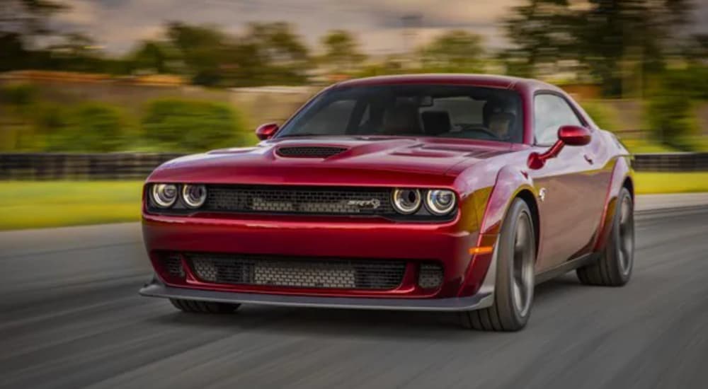 A red 2022 Dodge Challenger Hellcat is shown from the front.