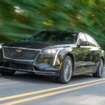 A black 2019 Cadillac CT6-V is shown from the front while driving down the road.