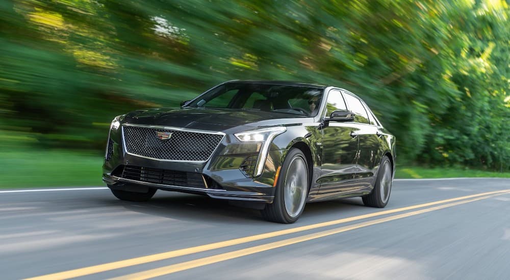 A black 2019 Cadillac CT6-V is shown from the front while driving down the road.