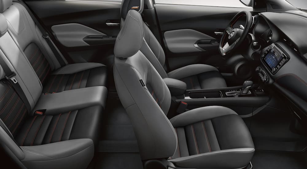 The grey interior of a 2022 Nissan Kicks shows two rows of seating.