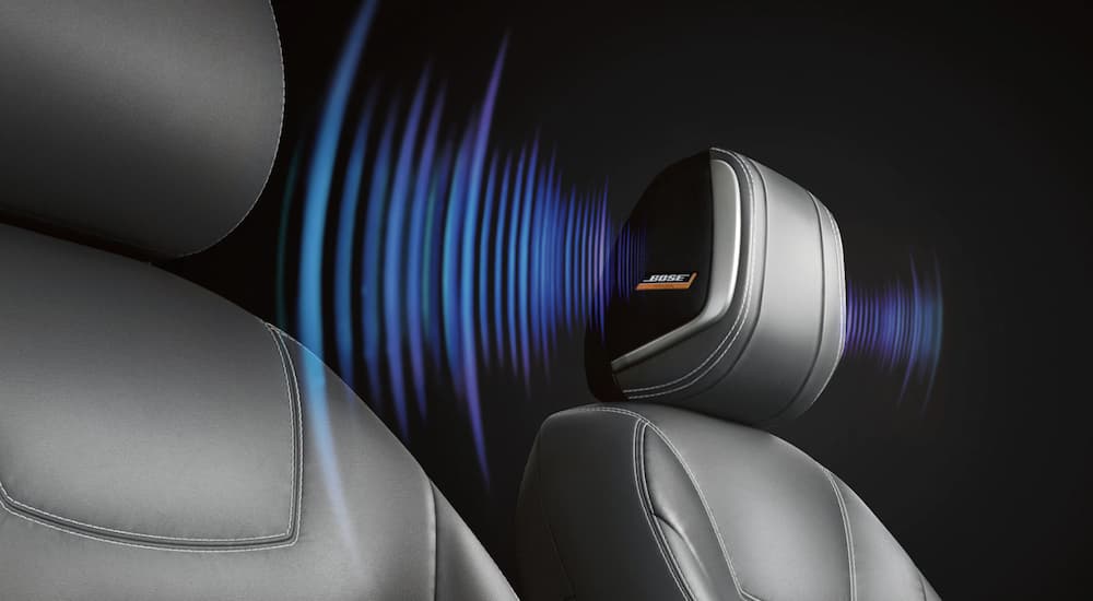 The grey interior of a 2022 Nissan Kicks shows the audio system in a headrest.