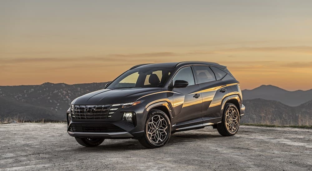 A black 2022 Hyundai Tucson N-line is shown from the front at an angle while parked.