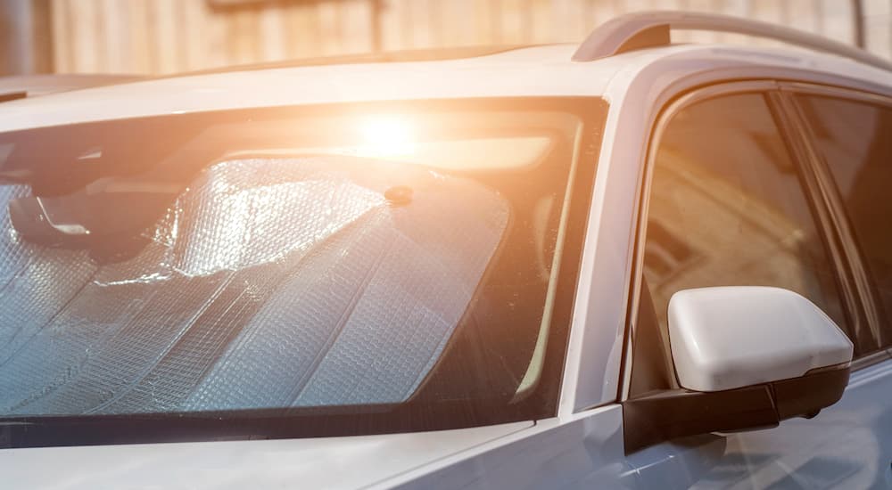 An SUV is shown from the front in the sun.