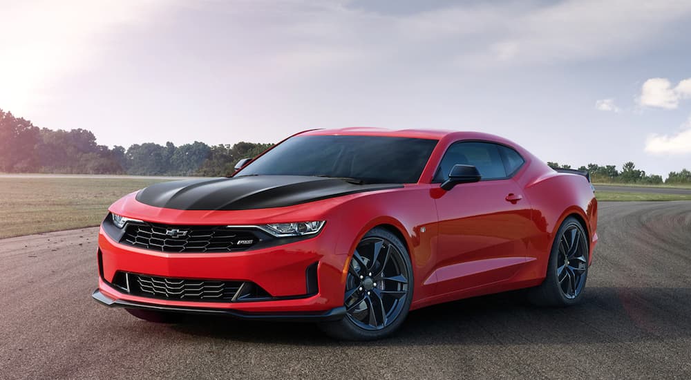 A red 2020 Chevy Camaro is shown from the front at an angle.
