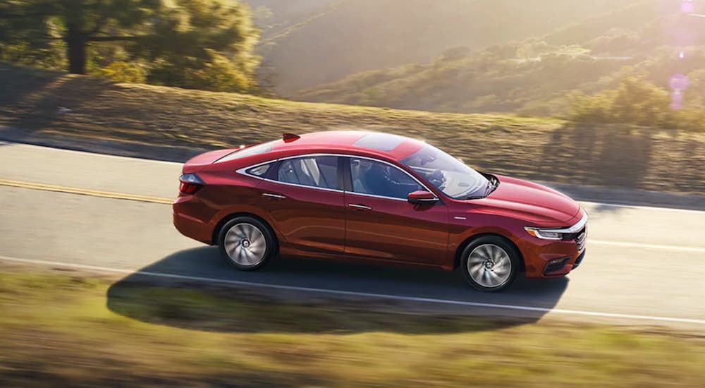 A red 2020 Honda Insight is shown from the side.