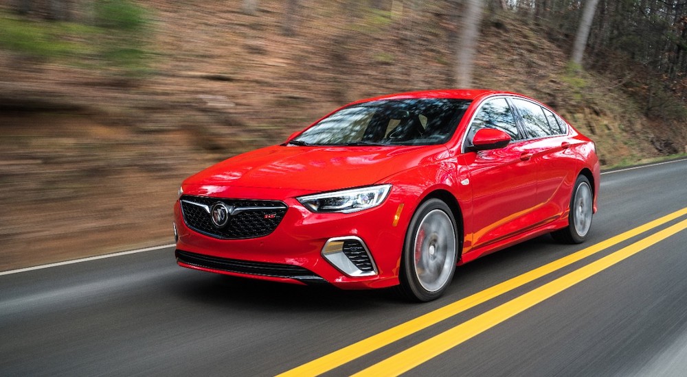 A red 2019 Buick Regal GS is shown from the front at an angle while driving.
