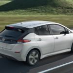 A white 2022 Nissan Leaf is shown from the rear after leaving a Nissan dealer.