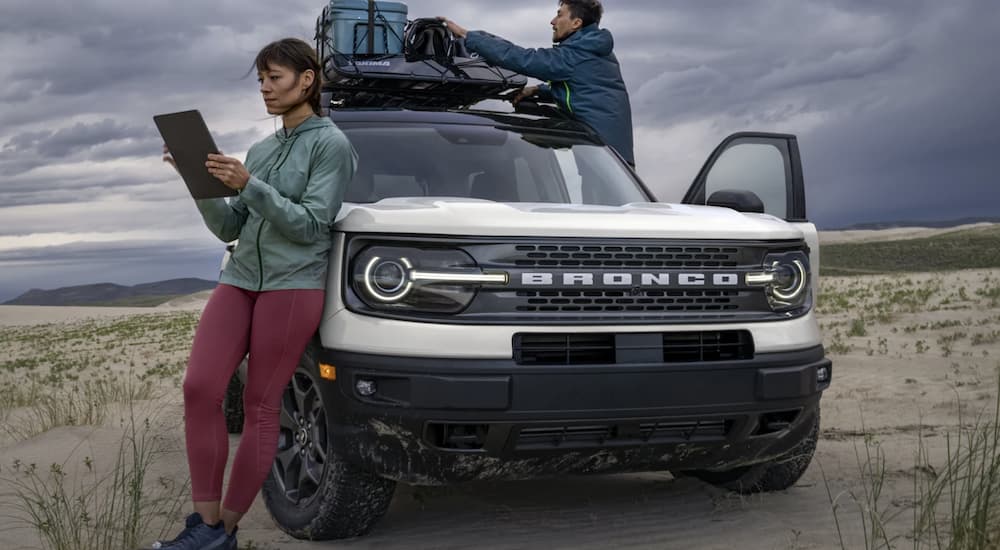 A white 2022 Ford Bronco Sport Big Bend is shown from the front parked in a desert.