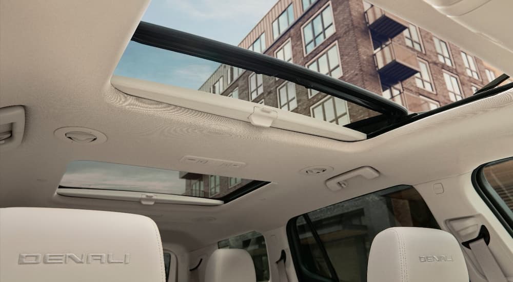 The sunroof is shown in a 2022 GMC Acadia Denali.