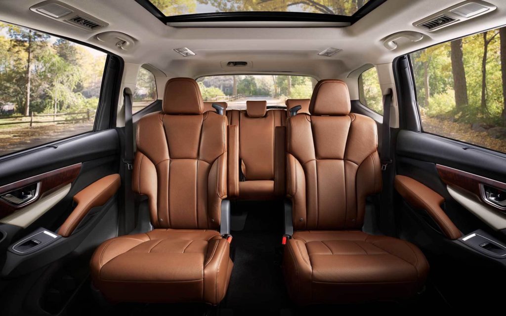The brown interior of a 2022 Subaru Ascent Touring shows the rear rows of seating.