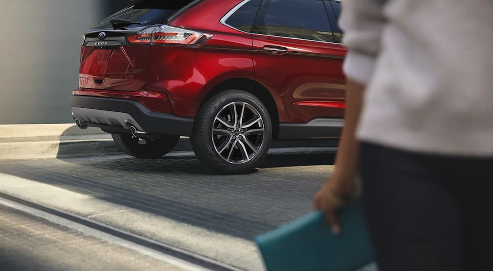 A view of the lift gate of a red 2022 Ford Edge Titanium is shown.