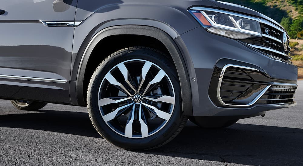A close up of the front wheel of a grey 2022 Volkswagen Atlas Cross Sport is shown during a 2022 Volkswagen Atlas Cross Sport vs 2022 Ford Edge comparison.
