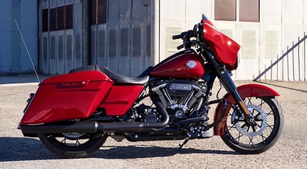 A red 2022 Harley-Davidson Street Glide Special is shown from the side while parked.