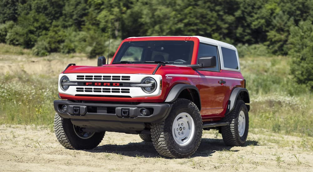 A red 2023 Ford Bronco Heritage Edition is shown from the front at an angle.