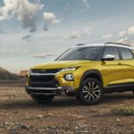 A yellow 2023 Chevy Trailblazer Activ is shown from a front angle while parked in the desert.
