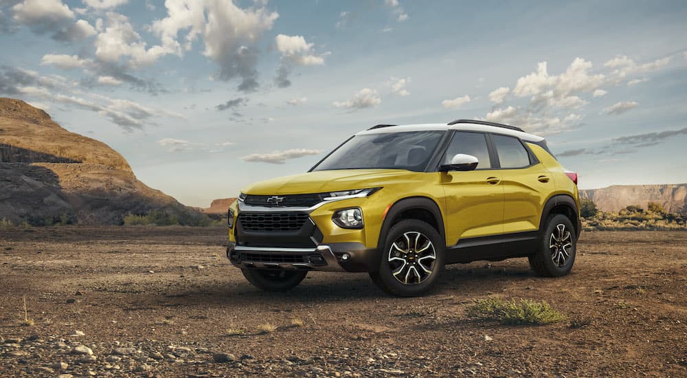 A yellow 2023 Chevy Trailblazer Activ is shown from a front angle while parked in the desert.