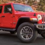 A factory order Jeep, a red 2022 Jeep Wrangler, is shown from the side.