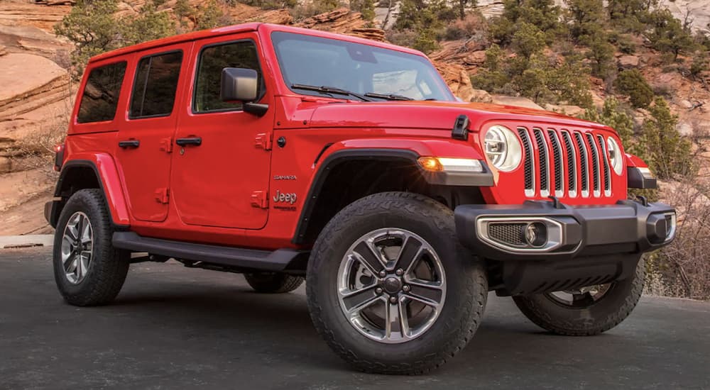 A factory order Jeep, a red 2022 Jeep Wrangler, is shown from the side.