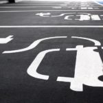 A close up of EV charging parking spots are shown.