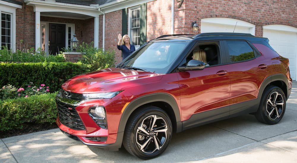 A red 2023 Chevy Trailblazer is shown parked in a driveway.