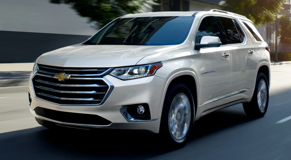 A white 2023 Chevy Traverse is shown from the front at an angle.