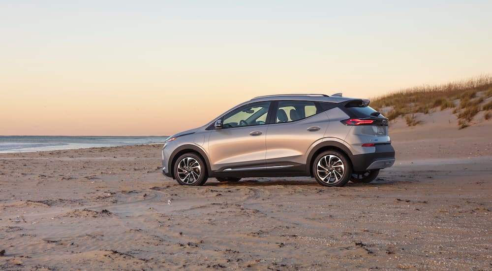 A silver 2023 Chevy Bolt EUV is shown near the ocean.