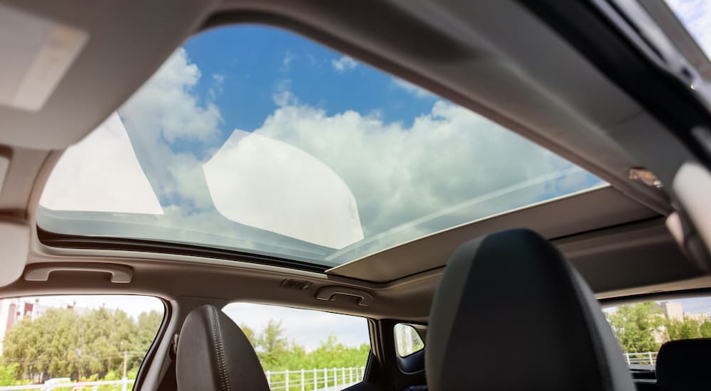 A sunroof is shown from the inside of a vehicle.