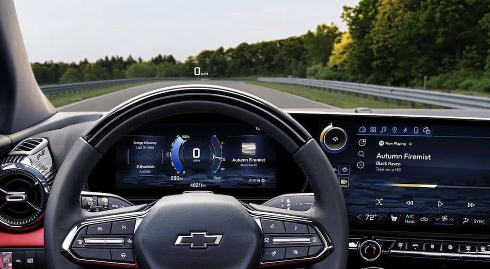 The black interior of a 2024 Chevy Blazer EV SS shows the steering wheel infotainment screen.