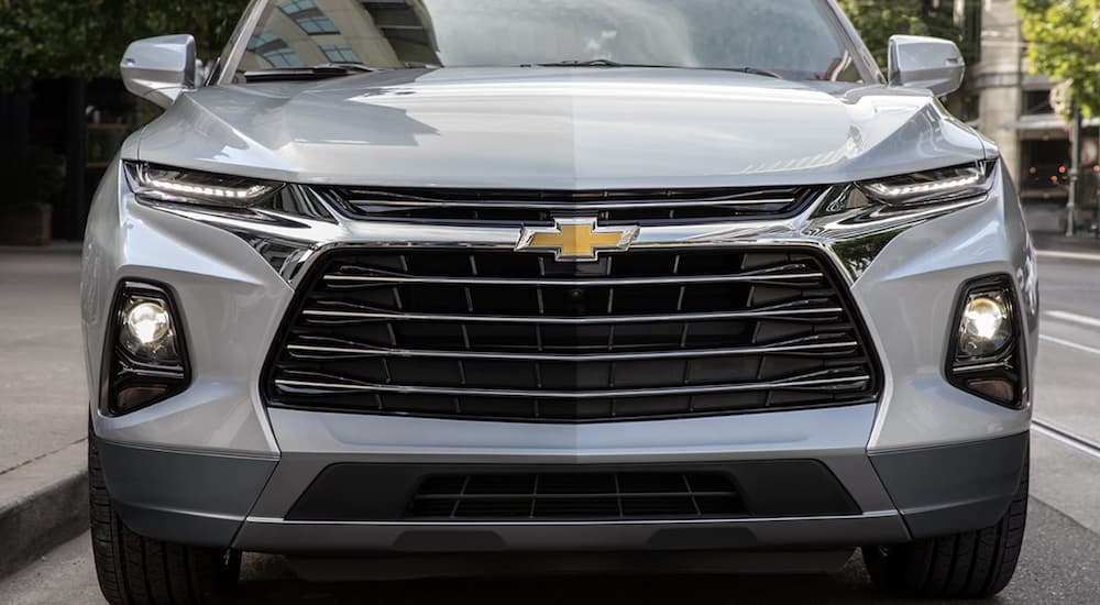 A silver 2022 Chevy Blazer is shown from the front parked at a Chevy dealership near you.