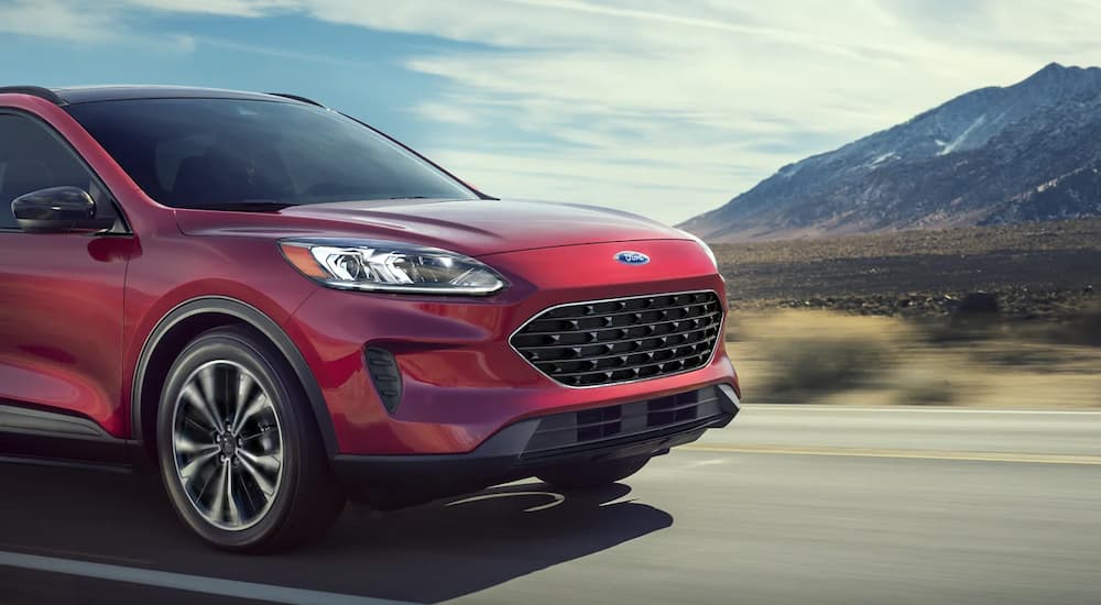 A red 2022 Ford Escape SE is shown leaving a Ford dealer near you.