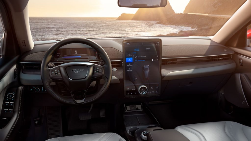 The steering wheel and center console of a 2022 Ford Mustang Mach-E is shown. 