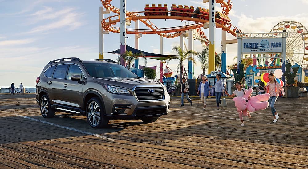 A brown 2022 Subaru Ascent is shown parked on a boardwalk.