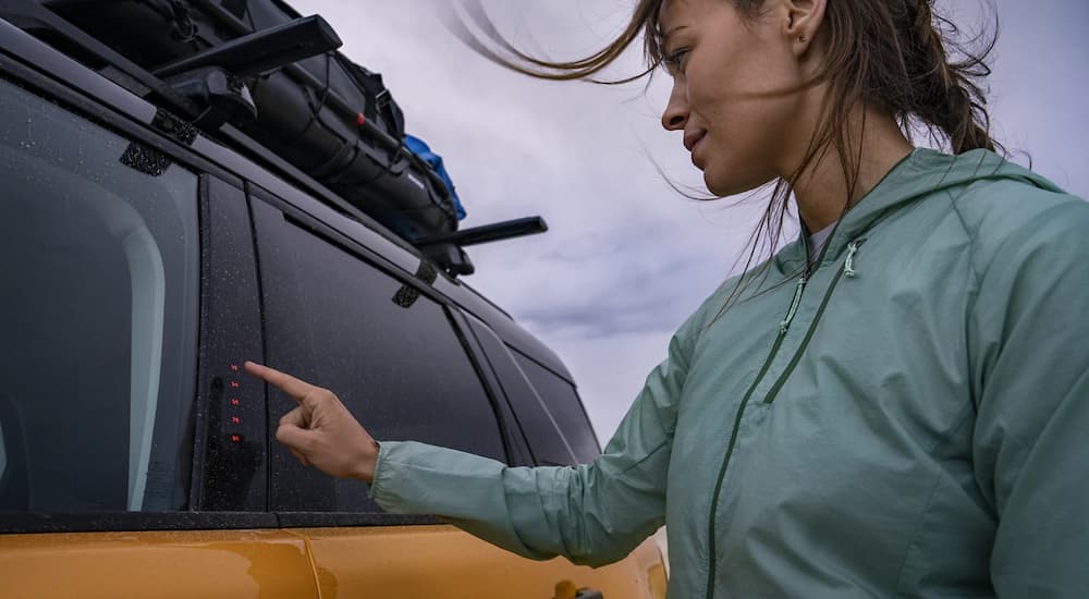 A person is shown using a SecuriCode on a 2022 Ford Bronco Sport.