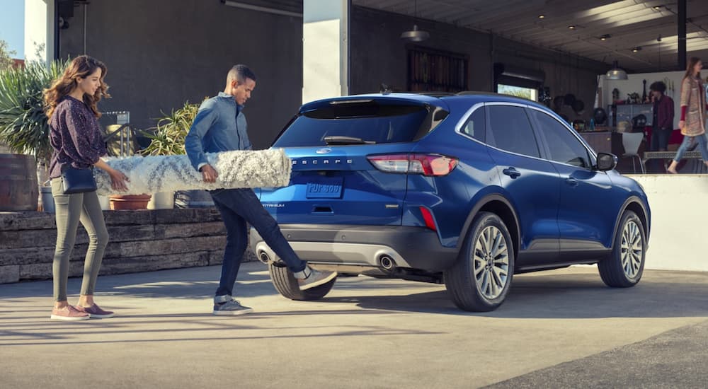 A blue 2022 Ford Escape is shown from the rear at an angle.