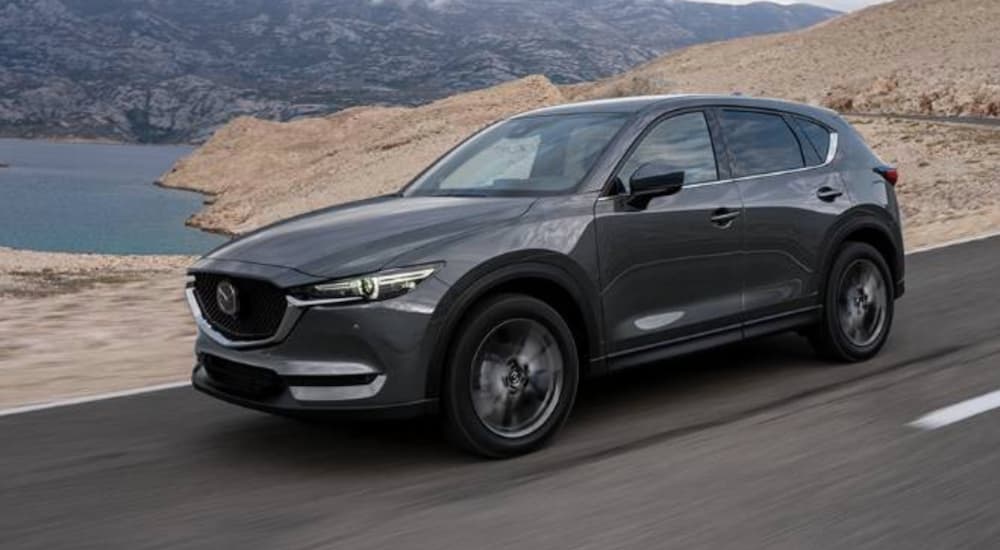 A grey 2020 Mazda CX-5 is shown from the front at an angle.