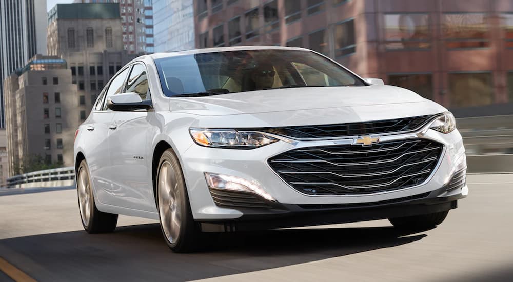 A white 2022 Chevy Malibu is shown from the front at an angle.