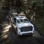 A white 2022 GMC Sierra 2500HD AT4 is shown from the front at a high angle.