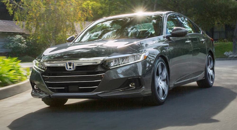A grey 2022 Honda Accord Hybrid is shown from the front during a 2022 Chevy Malibu vs. 2022 Honda Accord comparison.