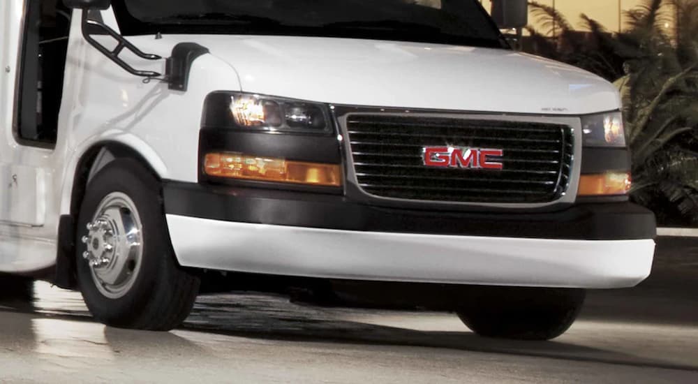 A close up of the front of a white 2022 GMC Savana Cutaway 3500 is shown.