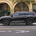 A black 2022 Subaru Ascent is shown from the side on a city street.