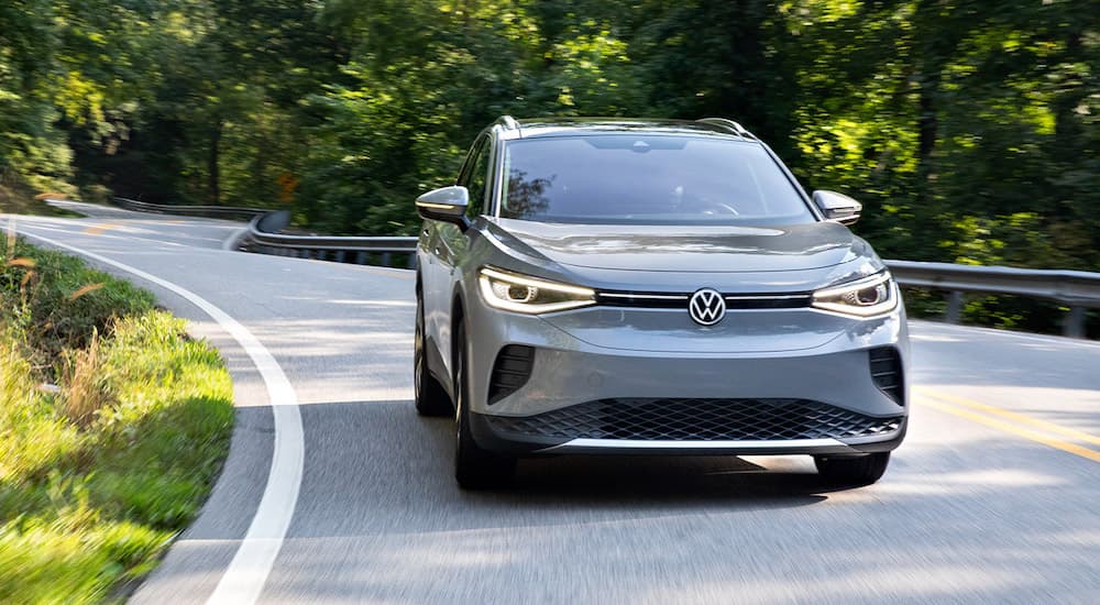 A grey 2022 Volkswagen ID.4 Pro S is shown driving on an open road after winning a 2022 Volkswagen ID.4 Electric Vehicle vs 2022 Chevy Bolt EUV battle.