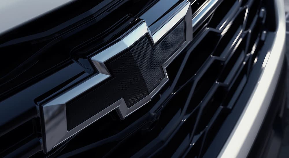 A close up of the Chevy badge on a 2023 Chevy Traverse is shown.