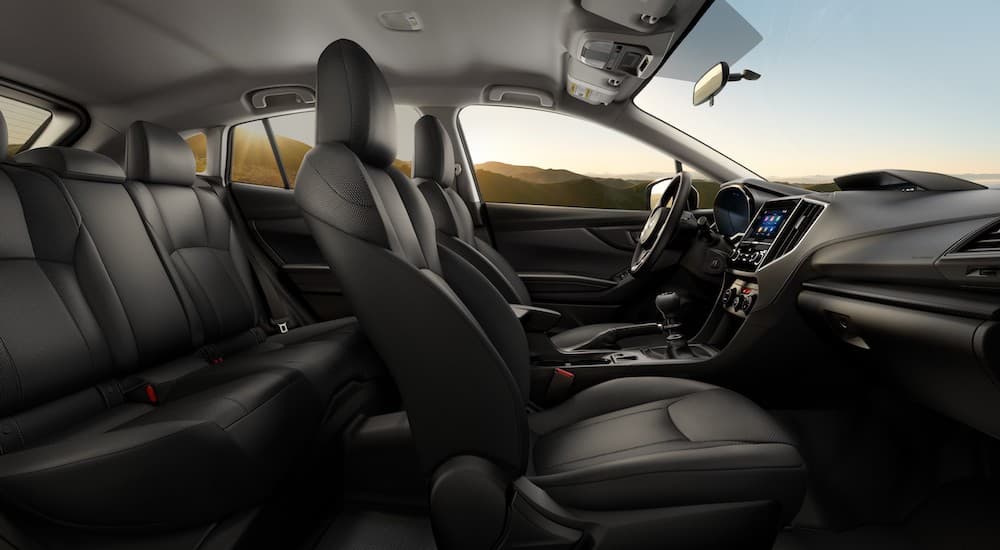 The interior of a 2023 Subaru Crosstrek is shown from the passenger.