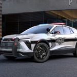 A white 2024 Chevy Blazer EV PPV is shown parked on pavement after leaving a local Chevy dealer.