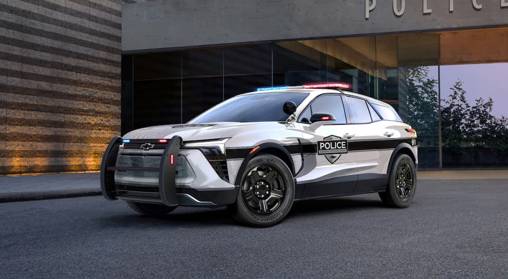 A white 2024 Chevy Blazer EV PPV is shown parked on pavement after leaving a local Chevy dealer.