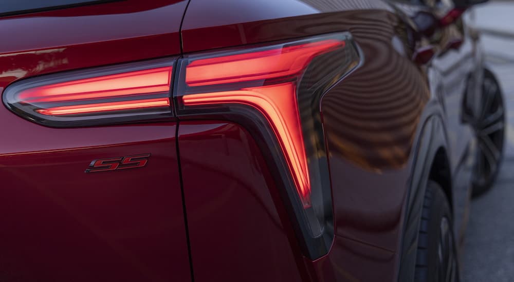 A close up shows the passenger side taillight on a red 2024 Chevy Blazer EV SS.