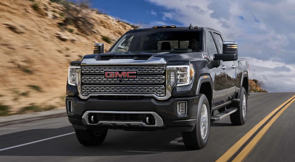 A gray 2023 GMC Sierra 2500 HD Denali is shown from the front at an angle.