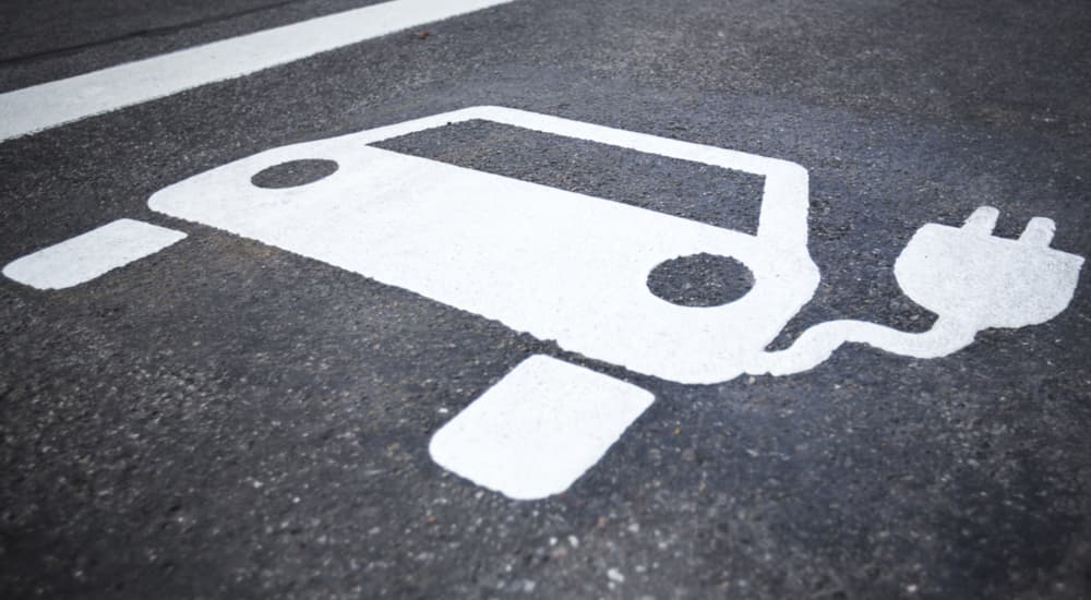 An electric vehicle charging spot is shown at a Honda dealer.