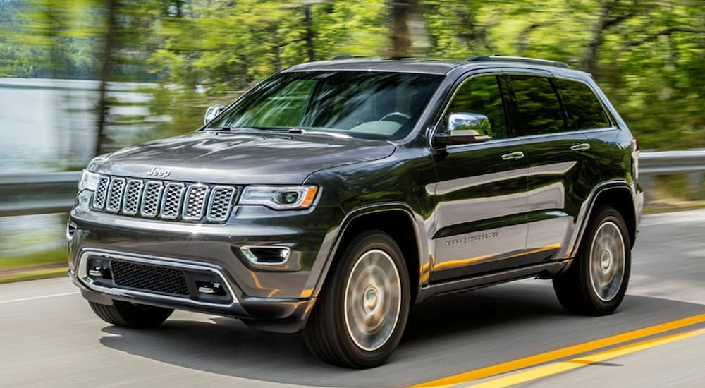 A grey 2020 Jeep Grand Cherokee is shown from the front at an angle.