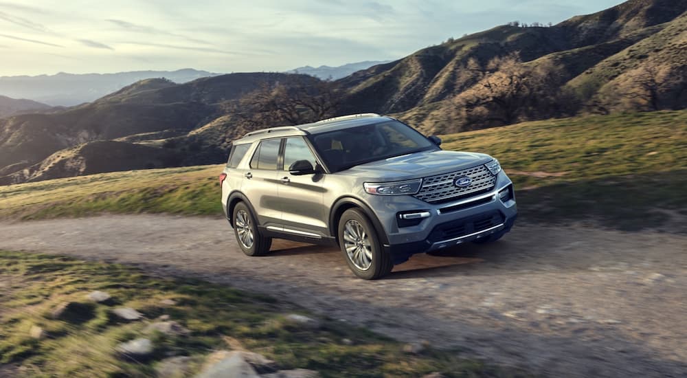 A silver 2020 Ford Explorer is shown from the front an angle on a dirt trail.